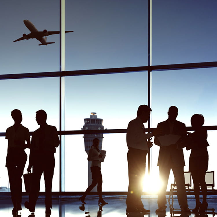 A crowd of people inside an airport terminal