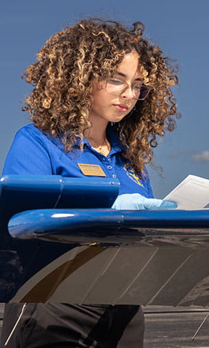 Students performing mock aviation safety inspections