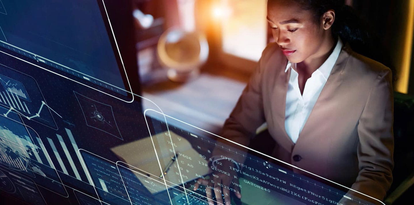 Woman in front of a futuristic computer