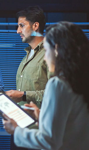 Two developers discussing data analysis