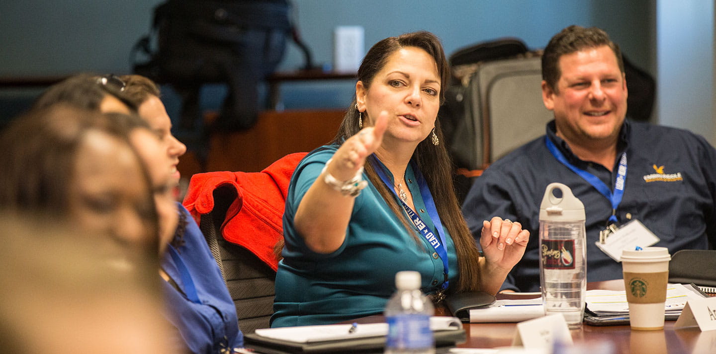 A woman leads a meeting