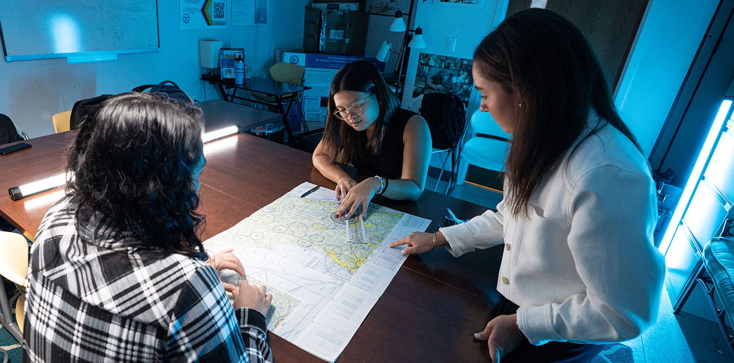 Students and professor working in the Applied Cognition and Training Lab