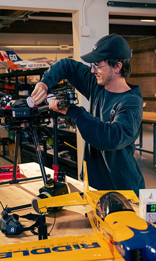 Student working on a drone