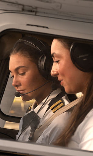 Student and flight instructor going through pre-flight inspection