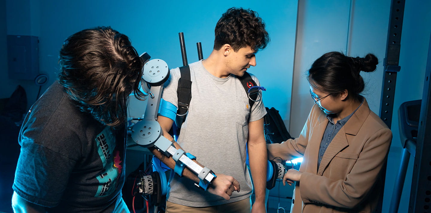 Dr. Luo and students working in the Robotics and Intelligence Learning Lab