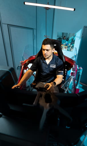 Student sits in a simulator.