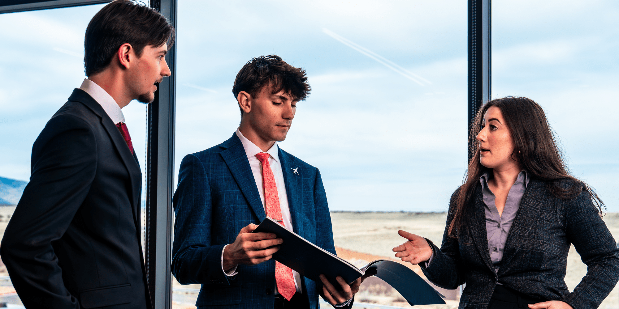 Airline management students in suits.
