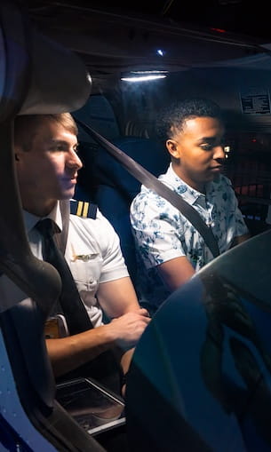 Two students in cockpit.