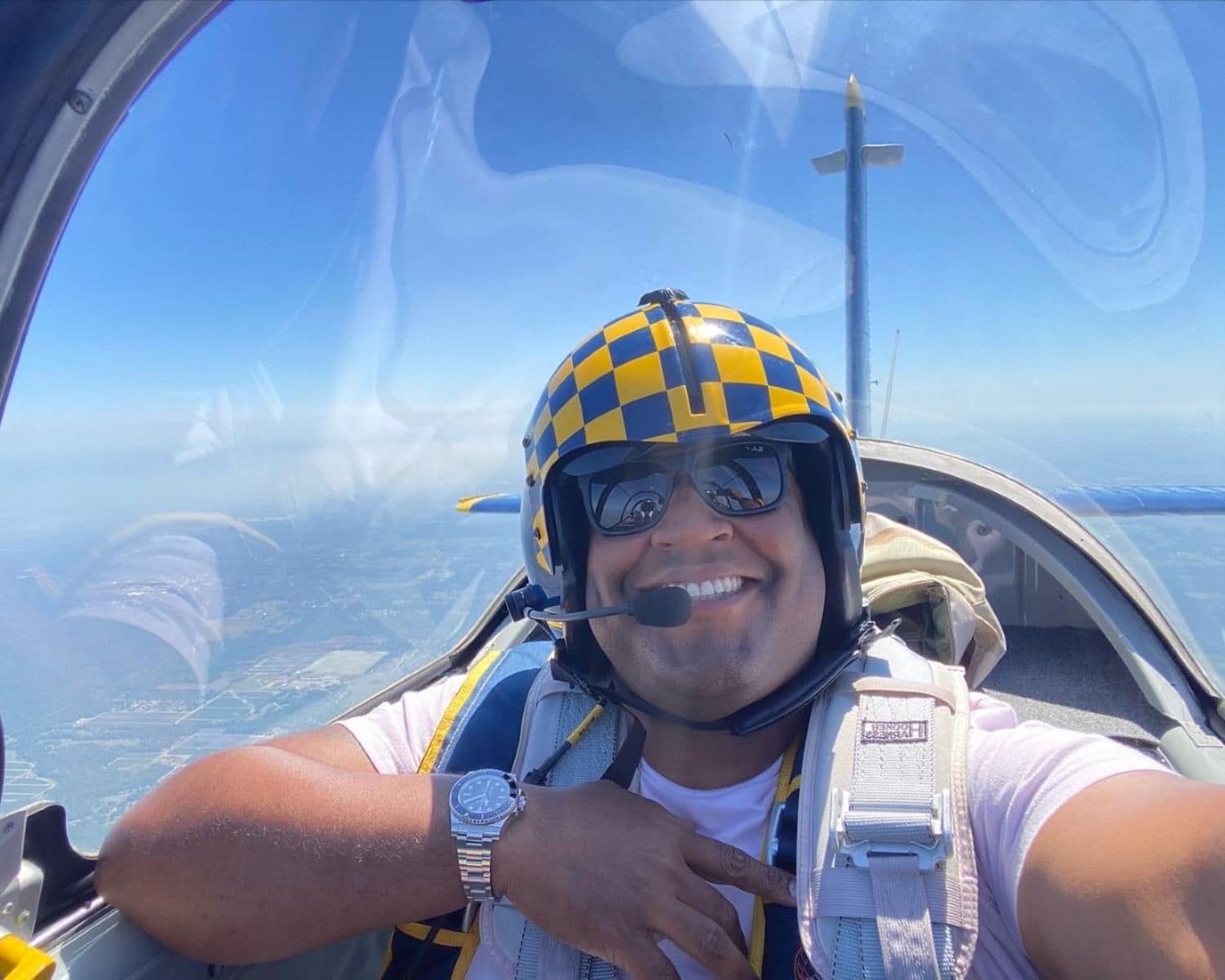 Nick Jacobs is in the cockpit of an aircraft in flight.
