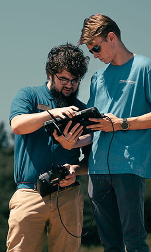 Students working with a UAS