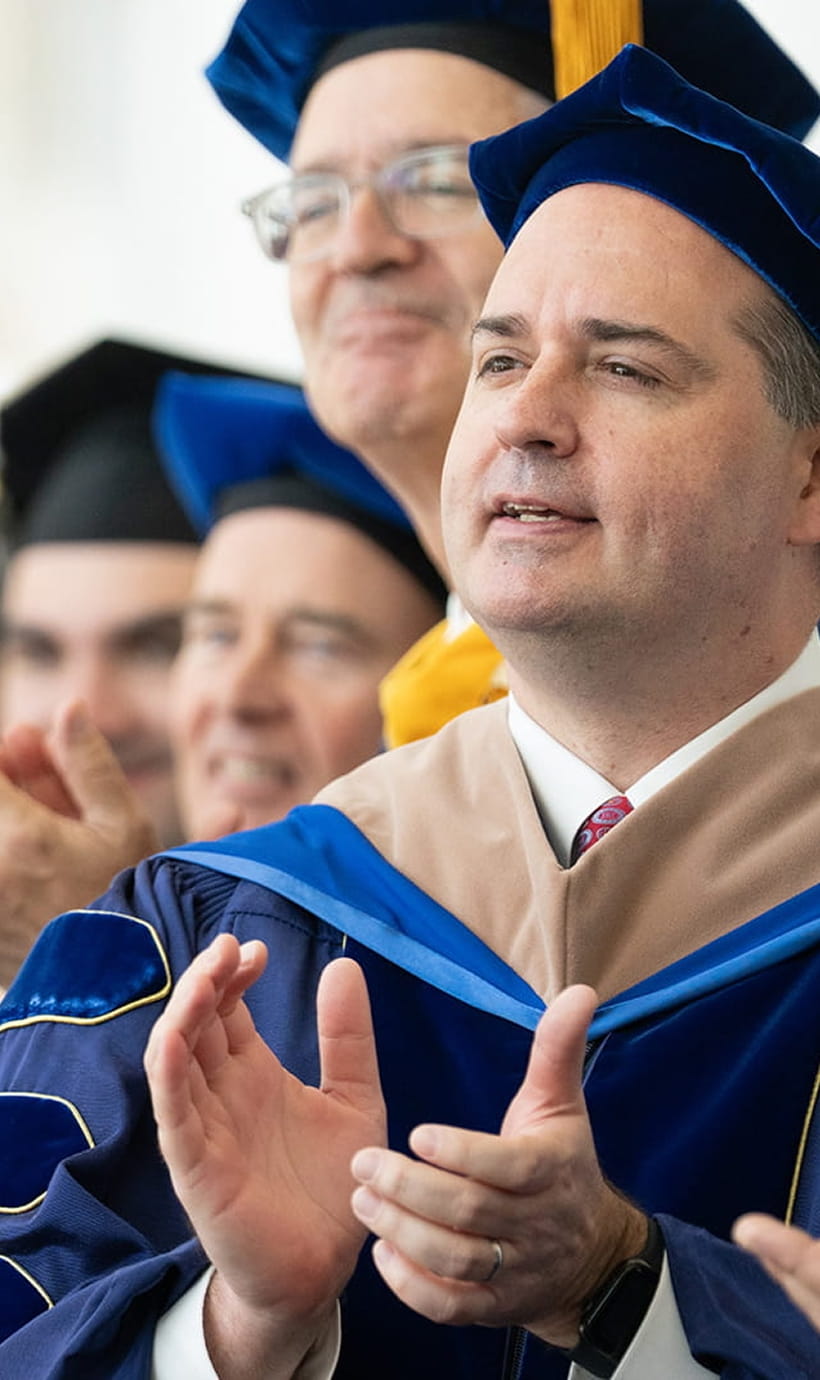 Faculty clapping at commencement