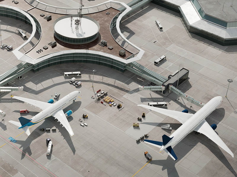 Planes sit near the airport, viewed from above
