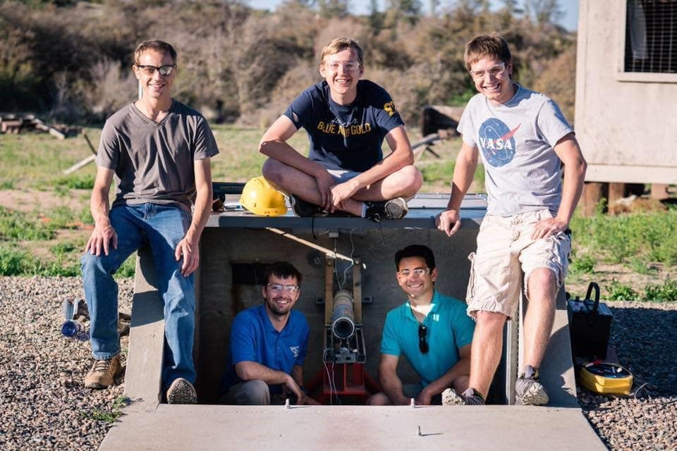 Five students from Embry‑Riddle's Rocket Team prepare to test their rocket at the Prescott Campus. (Photo: Embry‑Riddle / Connor McShane)
