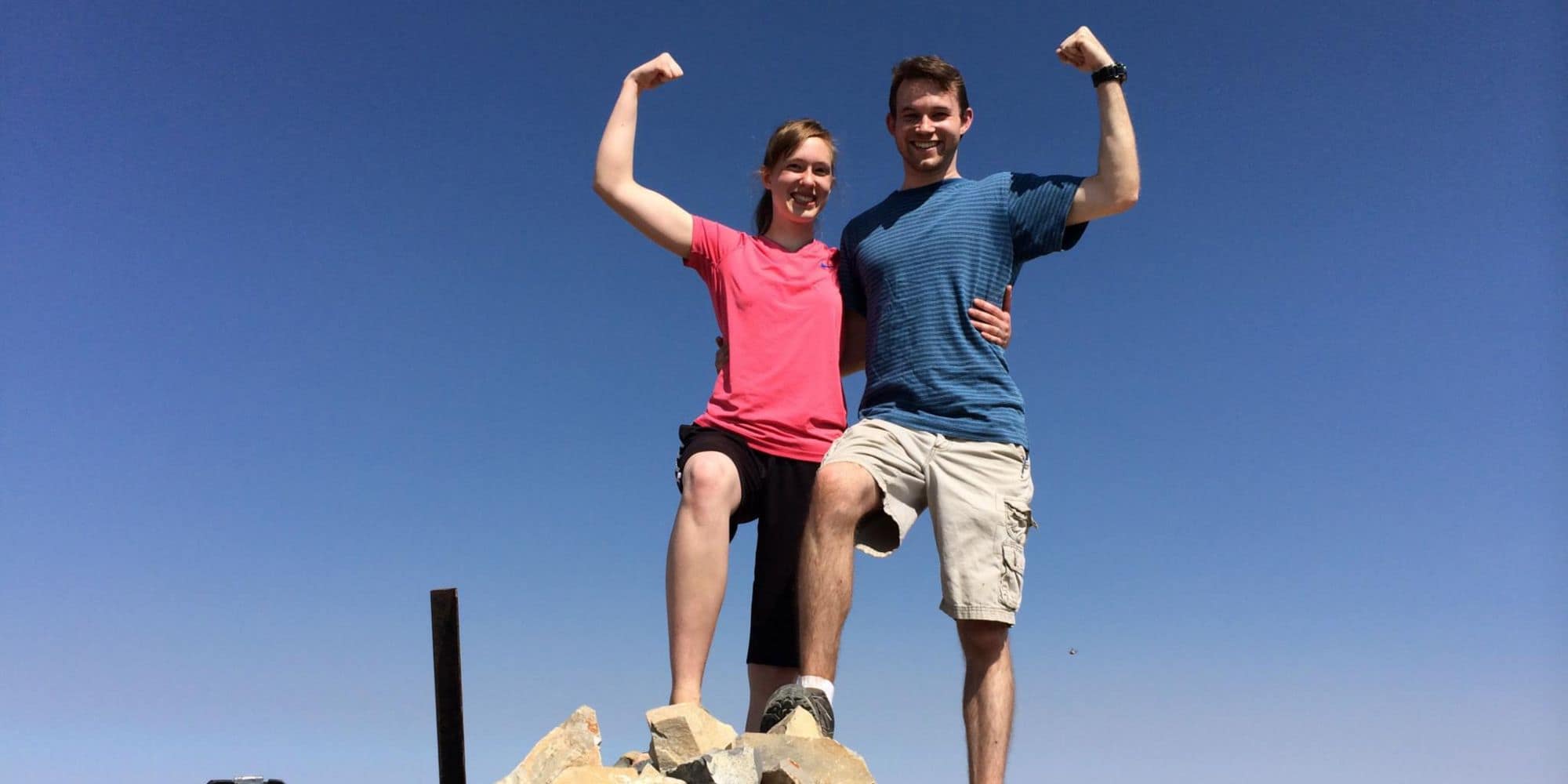 M.S. in Engineering student Nathaneal Hill and a friend flex their muscles during an outdoor hike. (Photo shot off-campus: Nathaneal Hill)