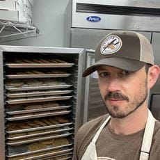 Alumnus Chris Welch has resumed his career flying for a major airline as well as growing his business as head of Aviation Cookie Company.