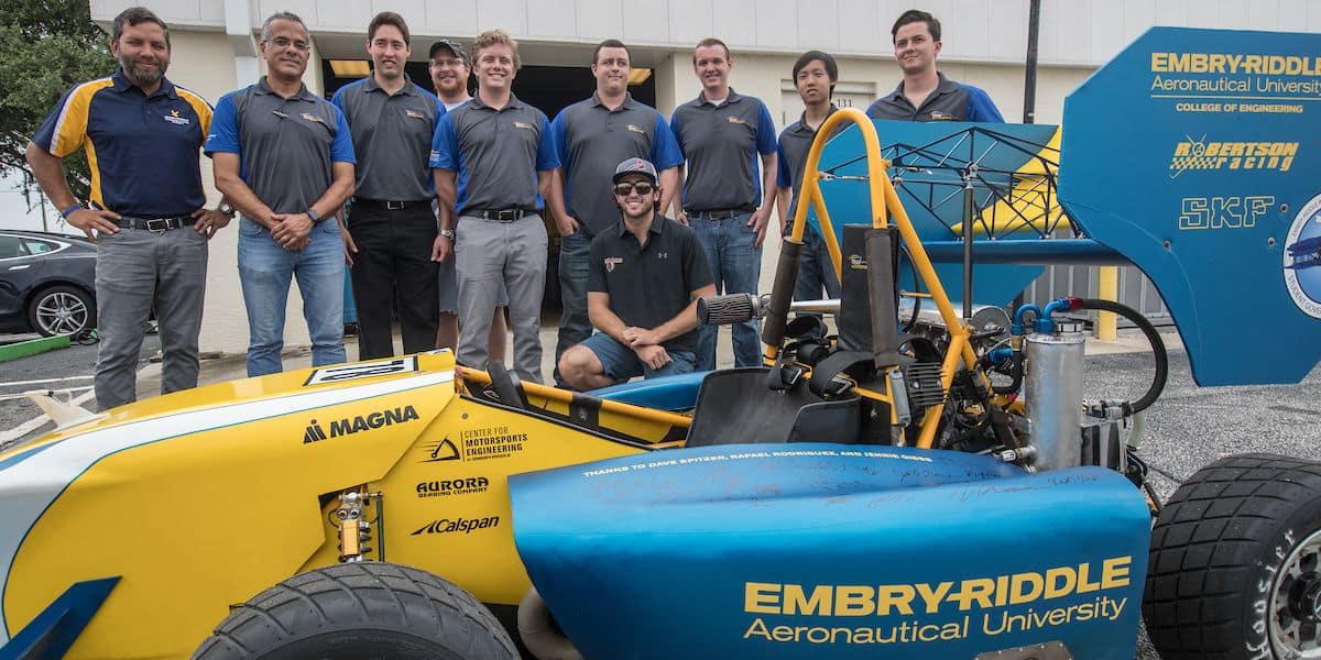 NASCAR driver and pilot Chase Ellliott and the ERAU Formula SAE Car team pose (Embry‑Riddle/David Massey)