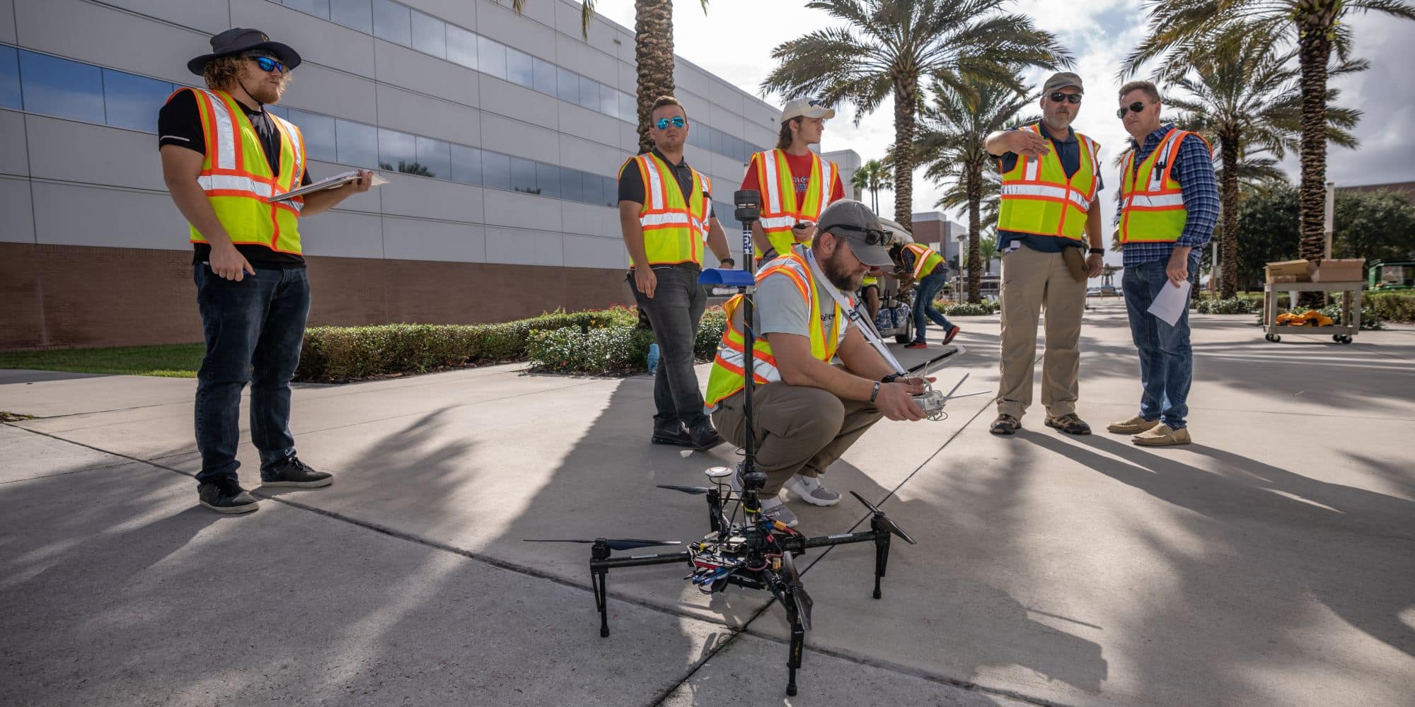 Students and faculty prepare to fly an unmanned aircraft system using proper safety equipment and procedures.