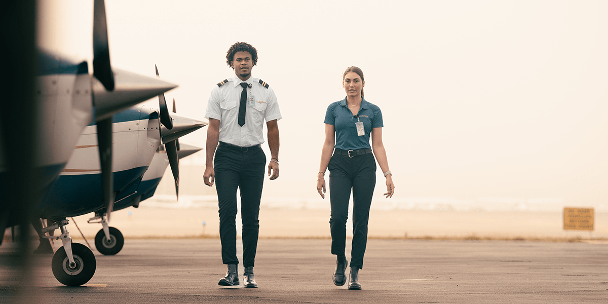 Embry-Riddle flight instructors walking on the flight ramp. (Photo: Embry-Riddle/Bill Fredette-Huffman)
