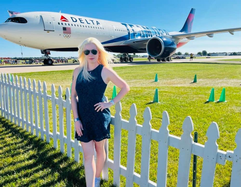 Delta Air Lines employee and Worldwide student April Bedunah poses in front of a Delta A-330 decked out in Team USA colors. (Photo: April Bedunah) 
