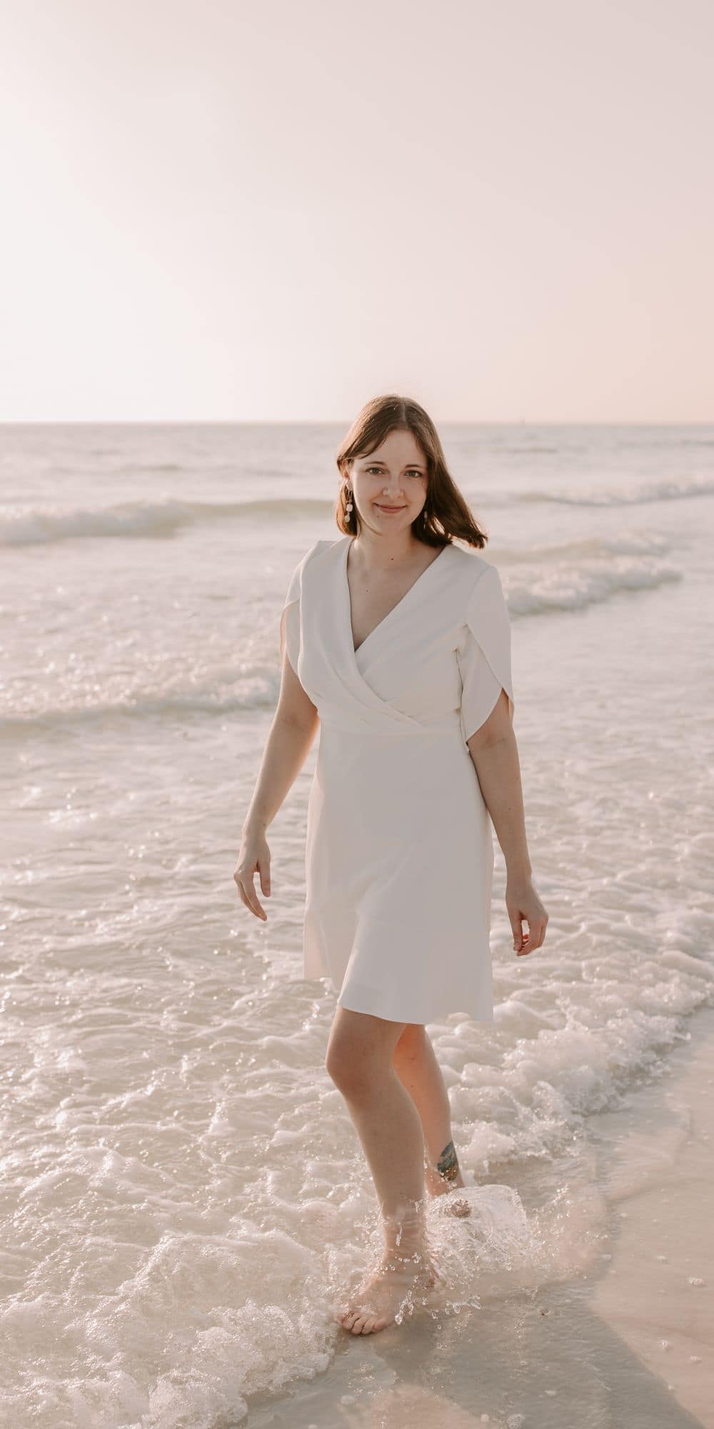 M.S. in Aviation grad Kayla Taylor takes a break from her research with a walk on the beach. (Photo: Alyssa Shrock)