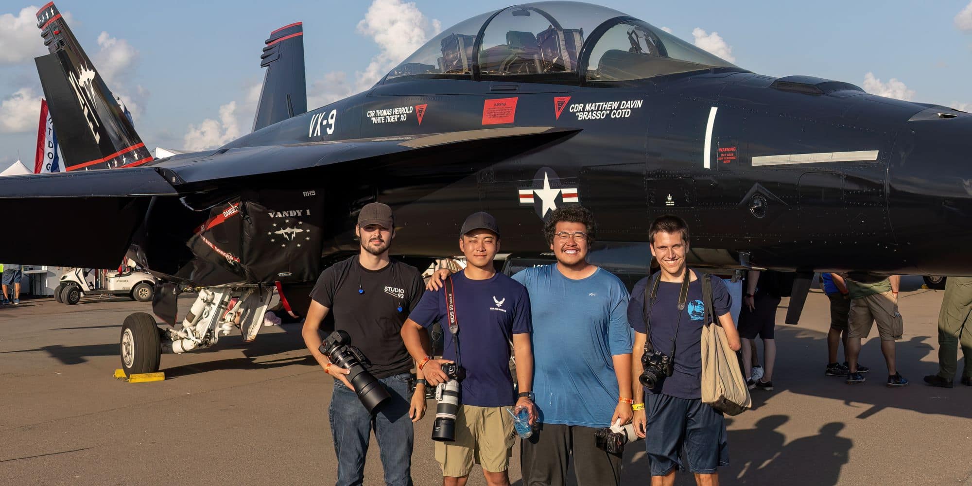 Bastien Melin, Hao Wu, Wen Wu and fellow photographer Chris Gammon pose in front of an F-18 Hornet during a trip to Sun ‘n Fun 2023. (Photo: Wen Wu.)
