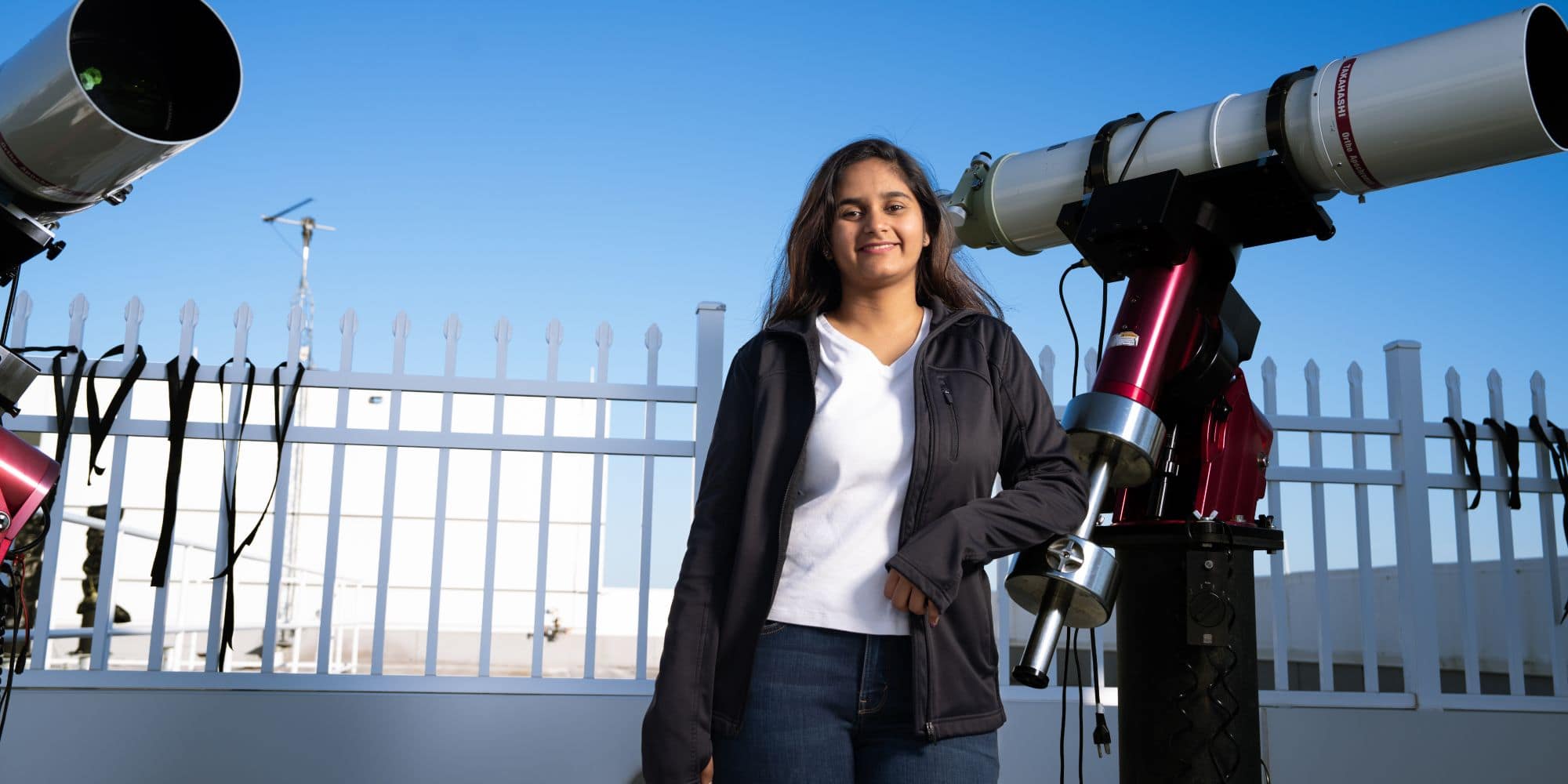 Divyeshwari Vansadia on the roof of the College of Arts and Sciences building on the Daytona Beach, Florida, campus. (Photo: Embry‑Riddle / Bill Fredette-Huffman)