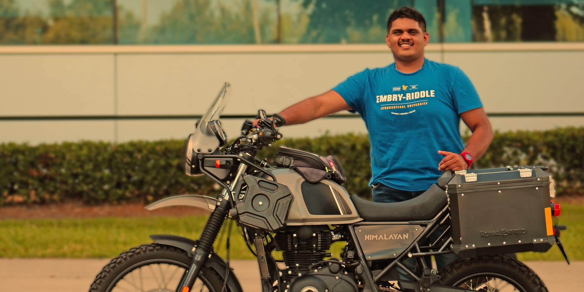 Mechanical Engineering student Arjun Menon with an adventure tourer motorcycle like those at the center of his traction control research. (Photo: Arjun Menon)