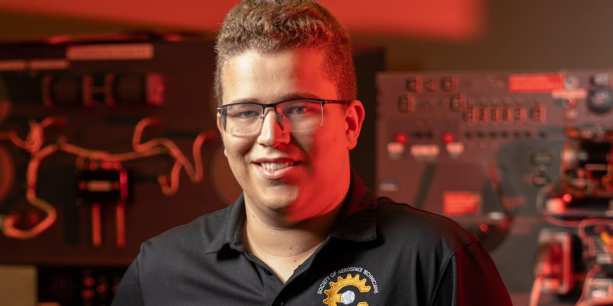 Philip Kwiecinski, shown here in one of Embry-Riddle’s aviation maintenance labs, is grateful for the support he’s received at the school. (Photo: Embry-Riddle / Bill Fredette-Huffman)