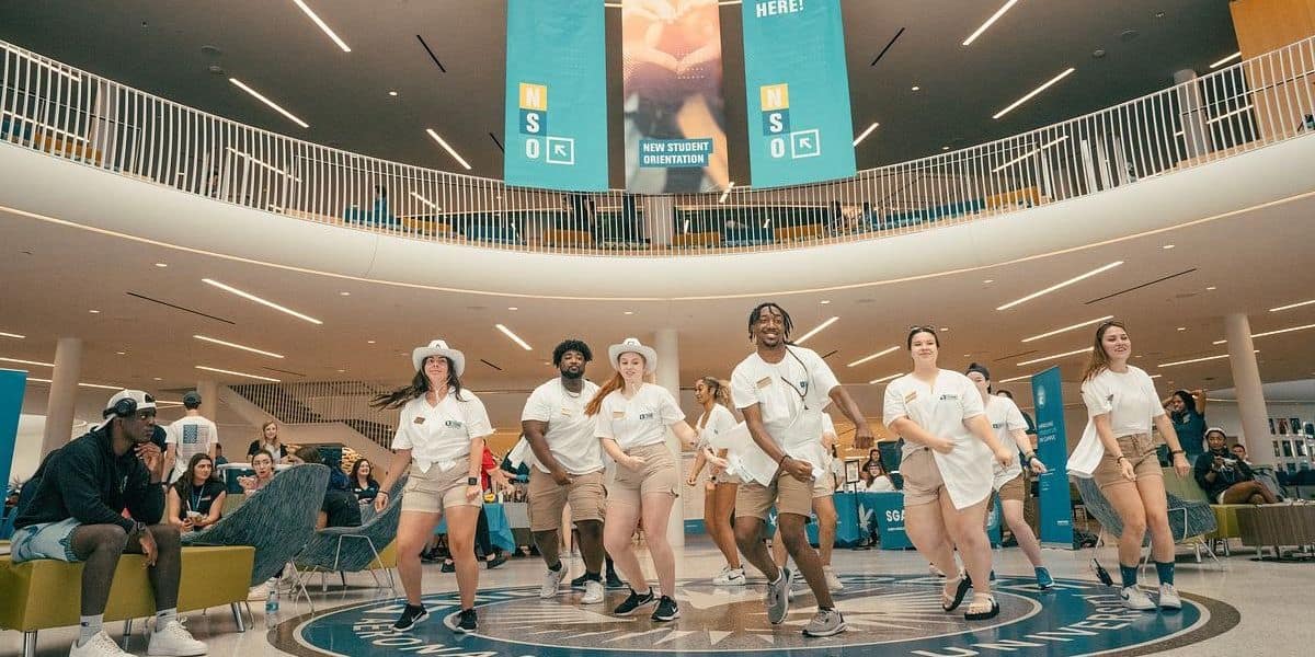 Members of Embry‑Riddle's Orientation team welcome new students to their Sunfest event on campus. (Photo: Embry‑Riddle / Bill-Fredette Huffman)