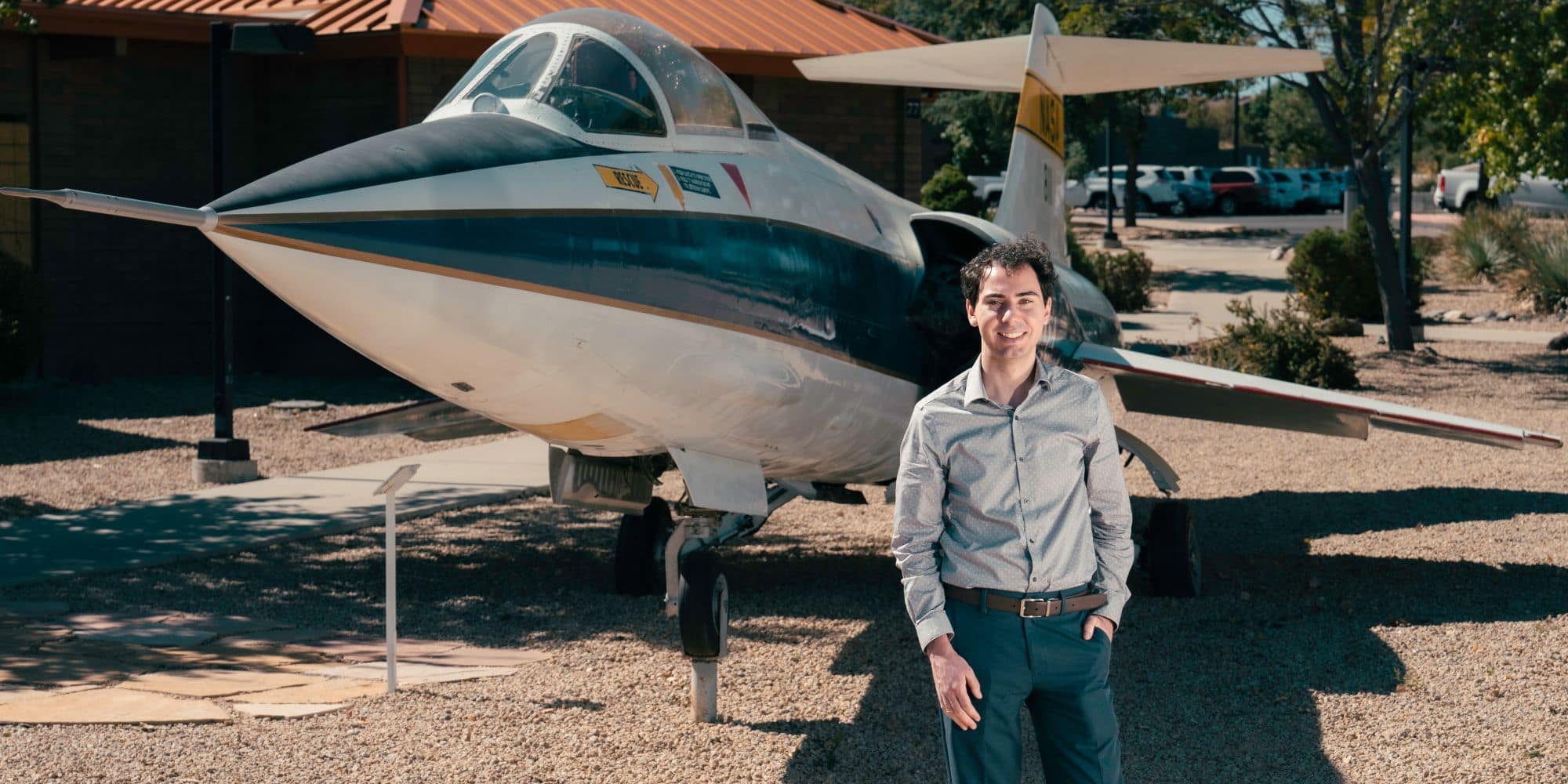 Adam Moore standing in front of the Lockheed F-104N "Starfighter" on Embry‑Riddle's Prescott Campus. (Photo: Embry‑Riddle / Connor McShane)
