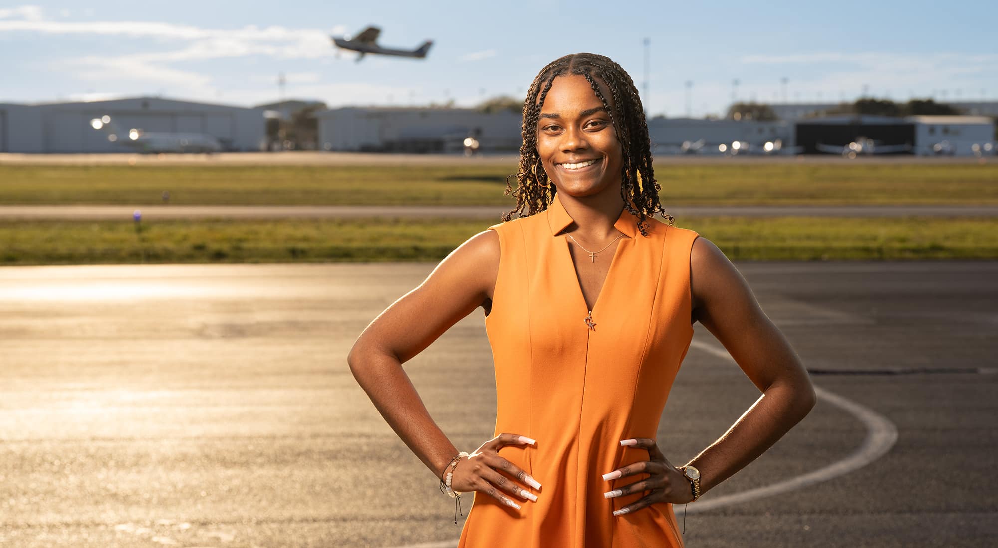 A departing Cessna 172 provides a perfect backdrop for Aviation Business Administration major and Boeing Scholar Coral Scotland. (Embry‑Riddle photo / Bill Fredette-Huffman)