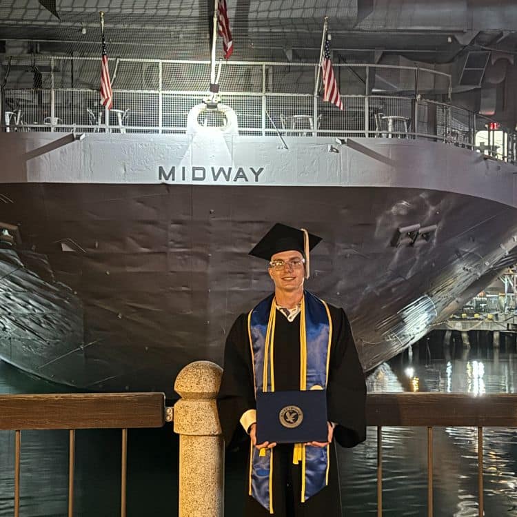 Brady Fredrickson displays his B.S. in Pilot Operations degree during the recent Worldwide Campus graduation ceremony in San Diego, California.