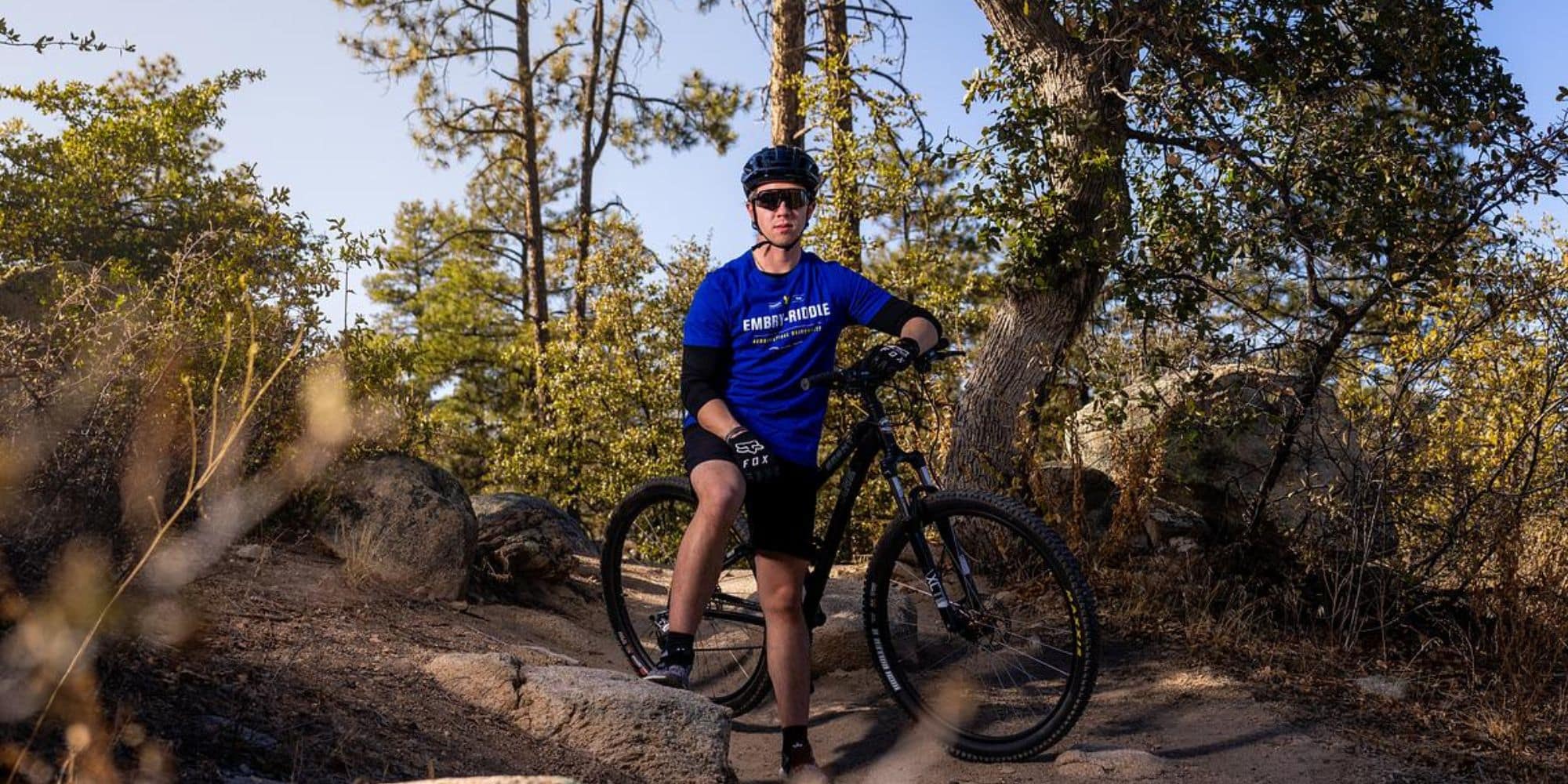 An Embry-Riddle student mountain biking near the Prescott campus.