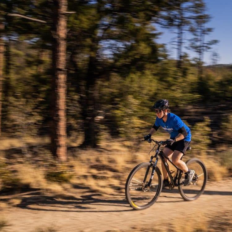 An Embry-Riddle student mountain biking near the Prescott campus.
