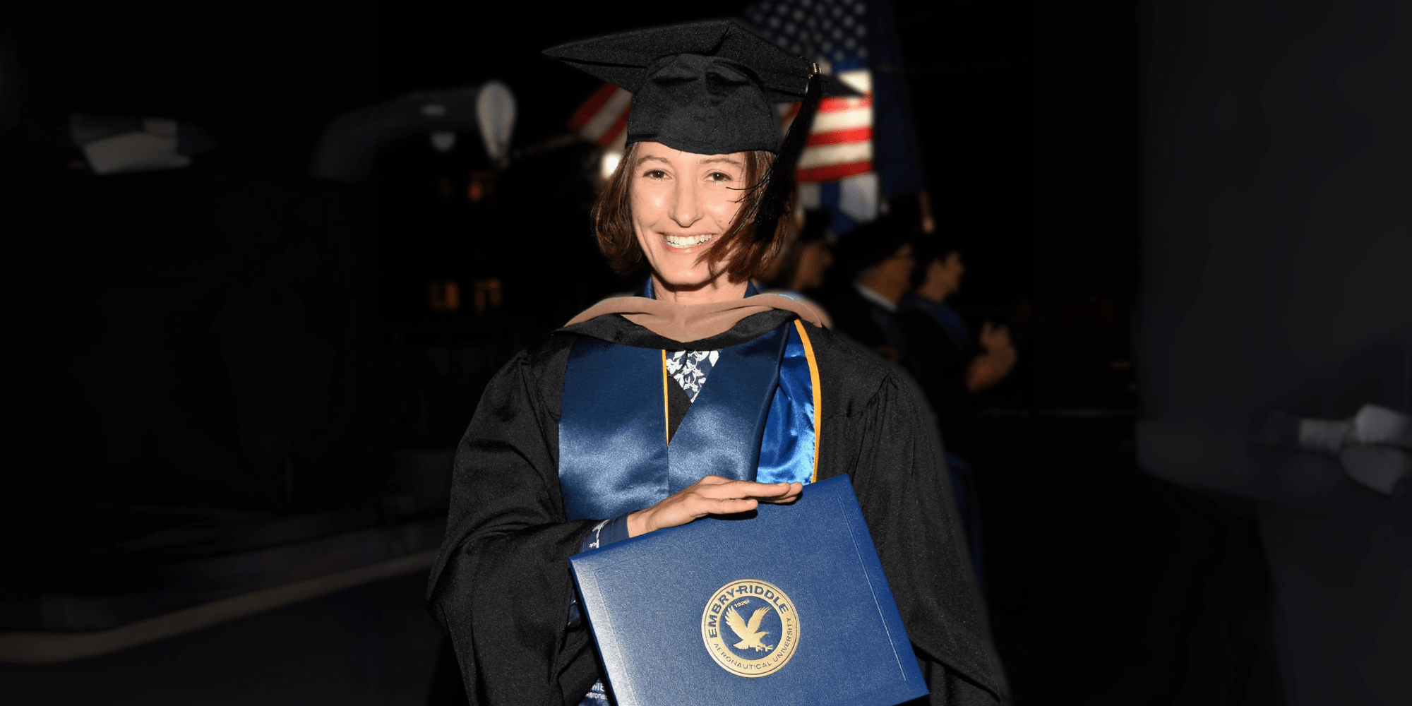 Andrea Psimer at commencement, accepeting her M.S. in Leadership diploma. (Photo: Andrea Psimer)