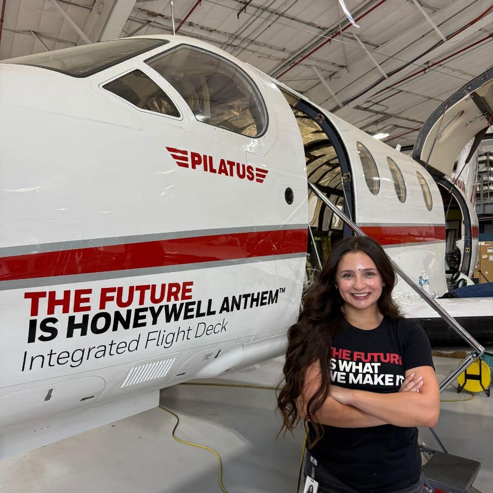 Anise Romo next to Honeywell plane.
