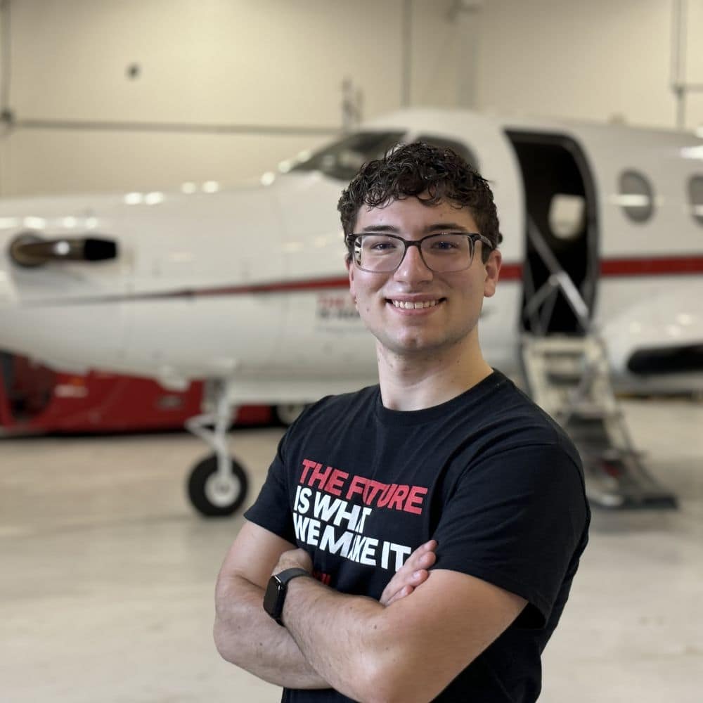 Christopher Sorensen next to plane.