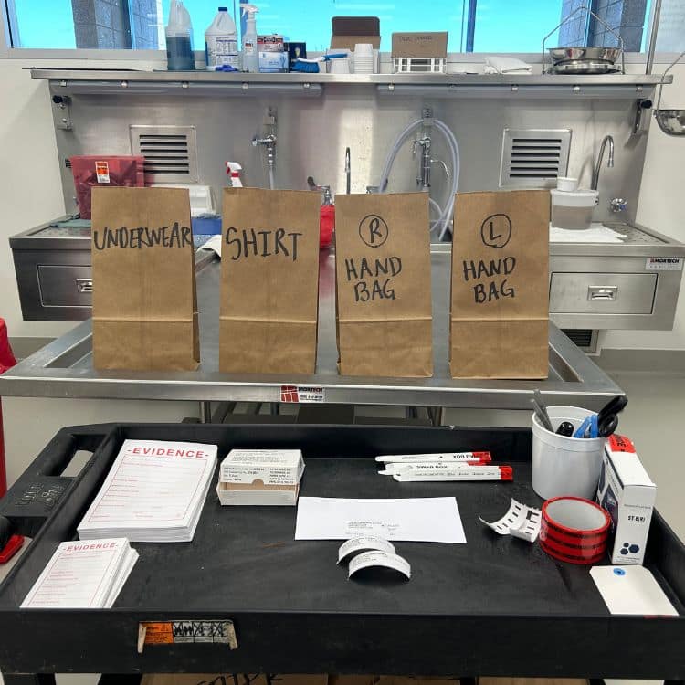 Setting up for collection of forensic evidence during postmortem examination. (Photo: Olivia Robbins) 