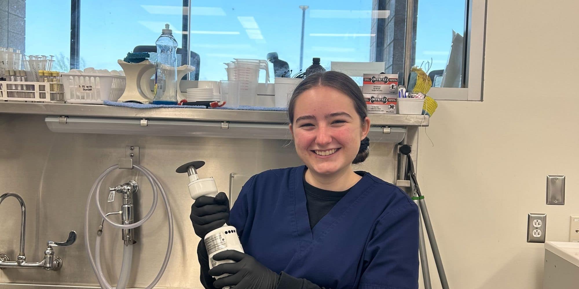 Holding the bone saw after performing my first two cranial eviscerations (photo taken after exams had concluded). (Photo: Olivia Robbins)