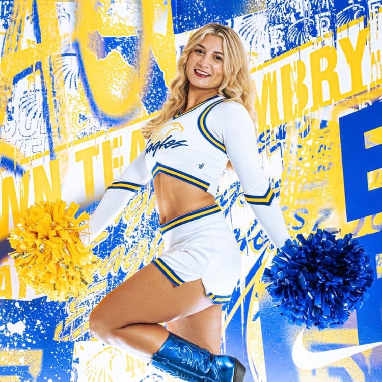 Gwynlyn Hannah poses for picture in cheerleading uniform.