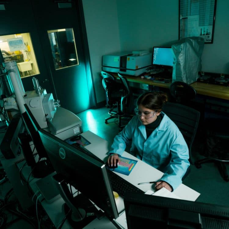 Dolha operating the microscope through the computer. (Photo: Joey Harrison)