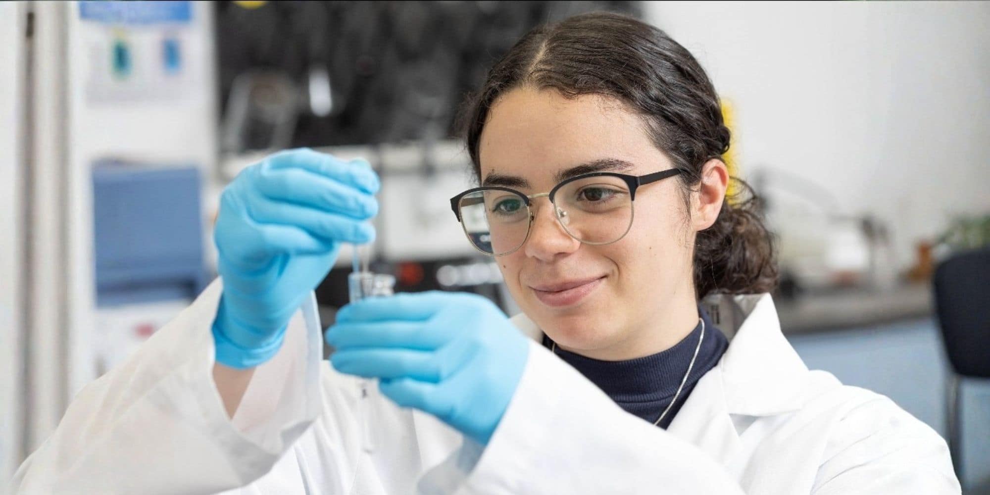 Tatiana Gomez transfers a prepared forensic sample into a GC/MS vial for laboratory analysis during her toxicology internship. (Photo: Tatiana Gomez)