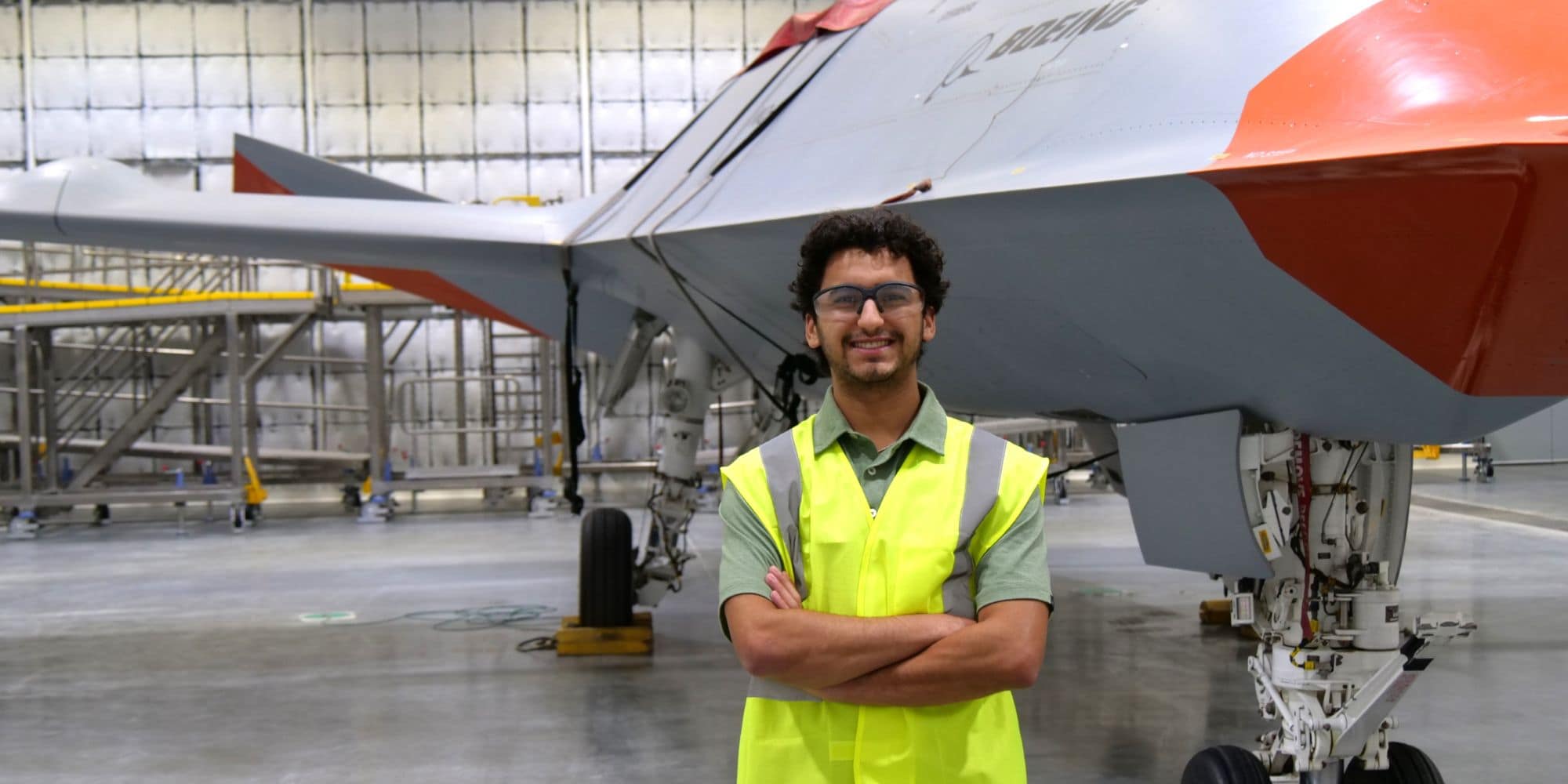 Brian Green stands in front of the MQ-25 Stingray at Boeing’s Mascoutah, Illinois, facility. (Photo: Brian Green)