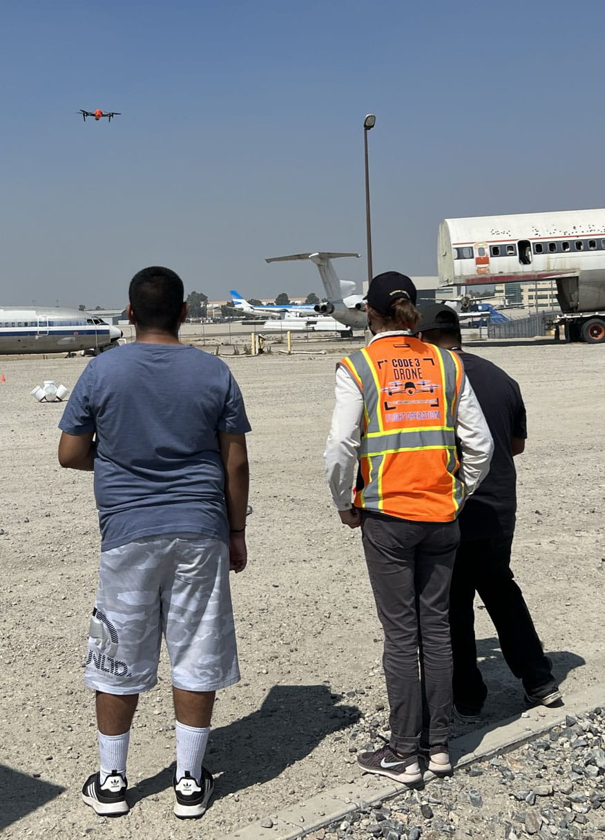 Embry-Riddle students fly a drone on the tarmac