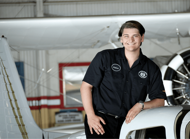 Aidan in a flight hangar