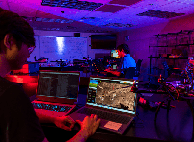 Students working on a drone