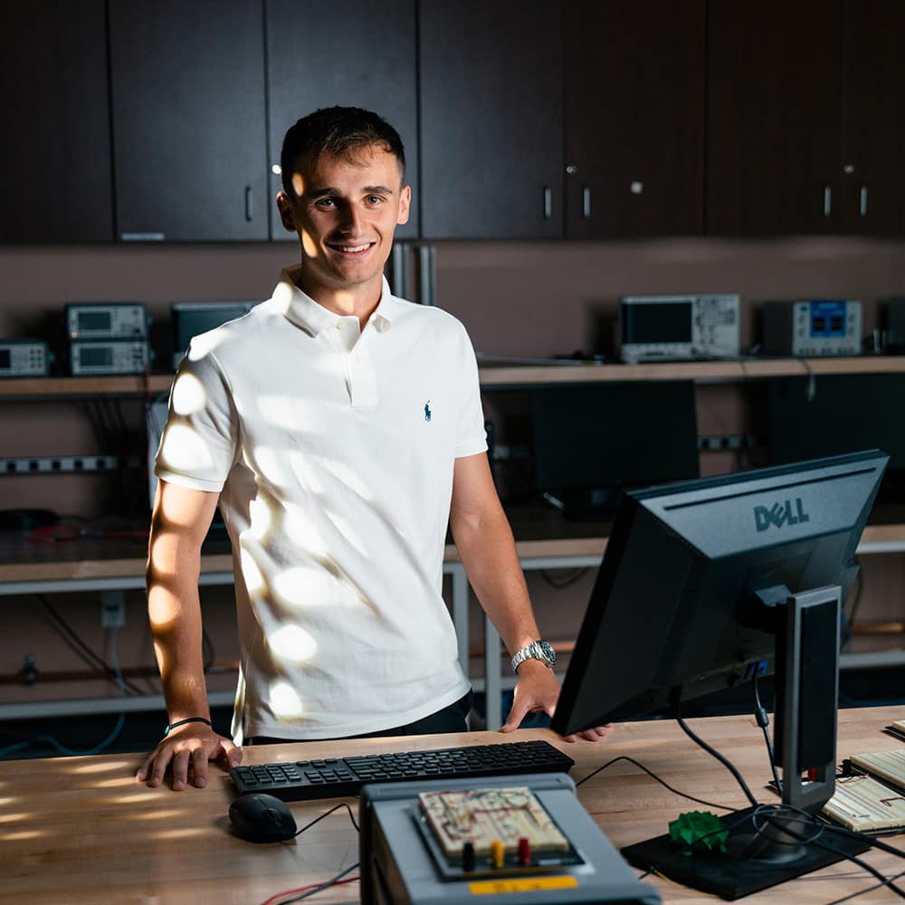 Embry-Riddle student stands in a lab 