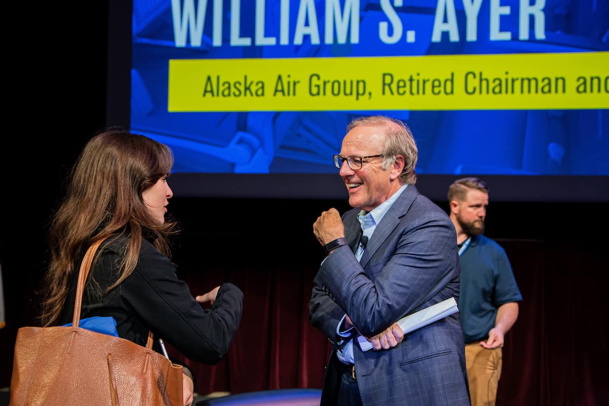 Bill Ayer talks to student.