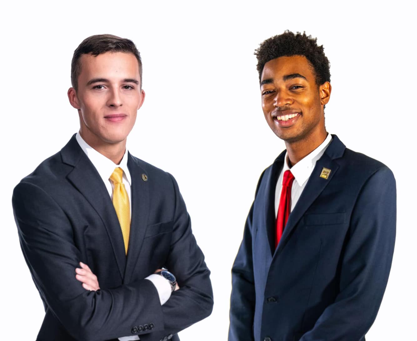 Two men in suits pose for picture.
