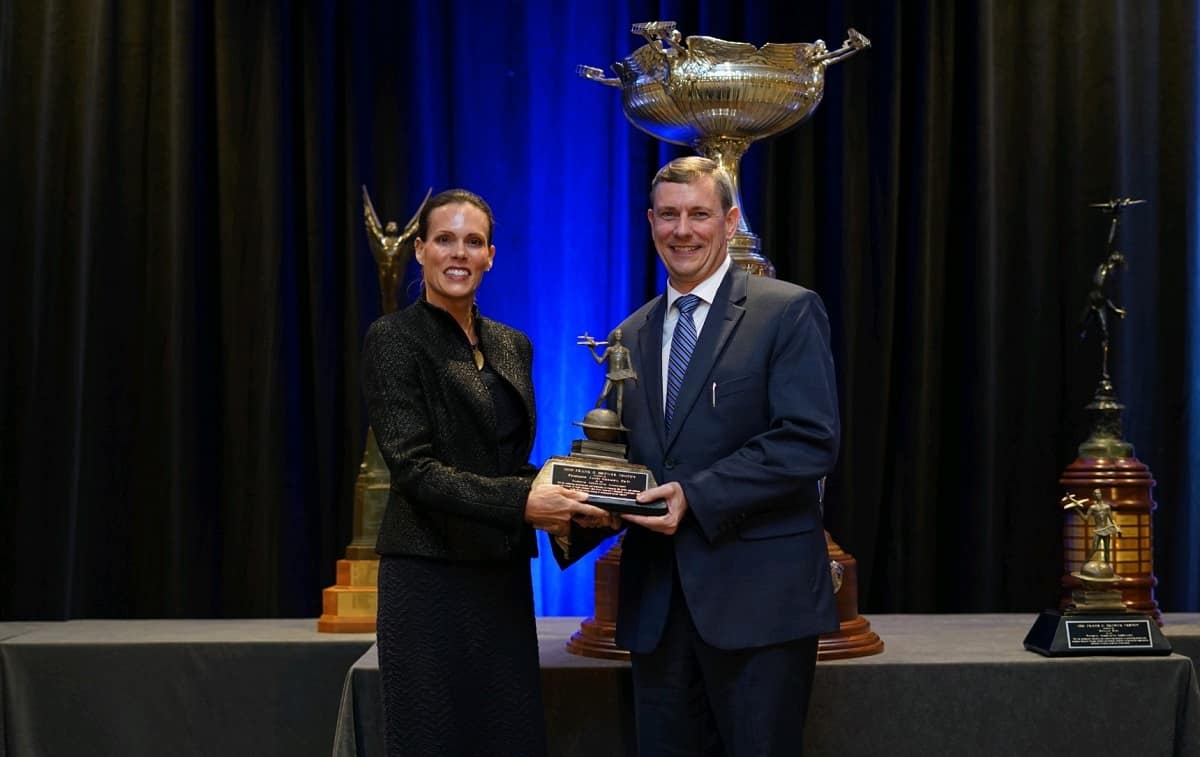 College of Engineering Dean Jim Gregory accepts the Frank G. Brewer Trophy.